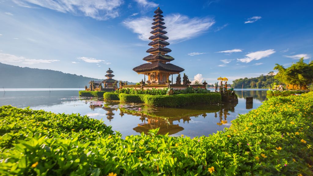Temple by the lake in Bali at sunrise, one of the best places to stay in Bali for culture and scenic views