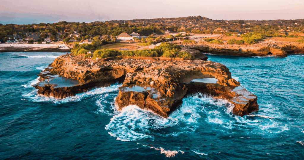 Rocky coastline and turquoise water near Nusa Lembongan, Bali